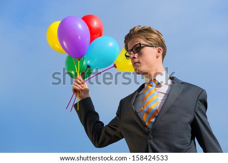 Business man outdoor with balloons