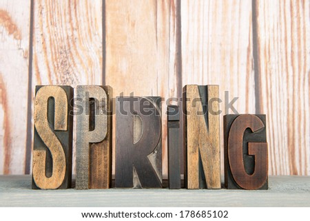 spring written with vintage used print letters