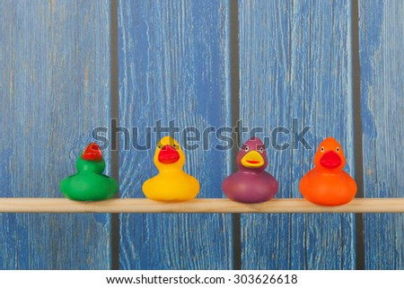 Funny bath ducks on stick in cage
