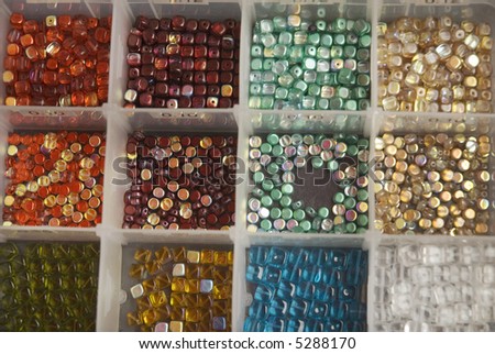 a box with beads in different colors