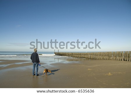 walking the dog at the beach