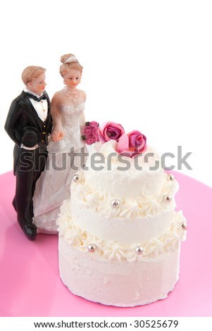 Wedding couple near the wedding cake with roses