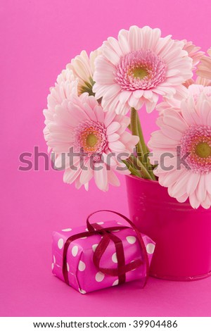 Pink birthday with bouquet Gerber and present