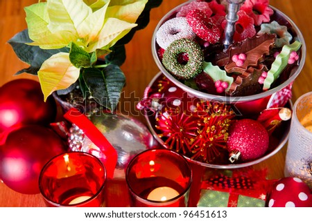 Christmas still life with chocolate sweets and Poinsettia
