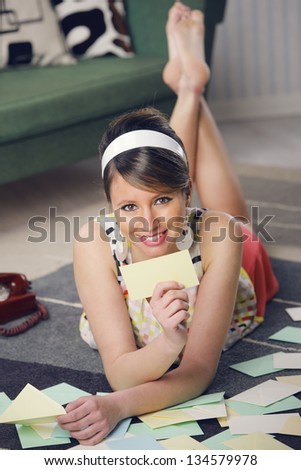 Attractive girl with Valentine card or loveletter