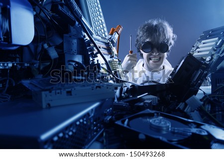 Crazy computer technician is trying to repair a computer