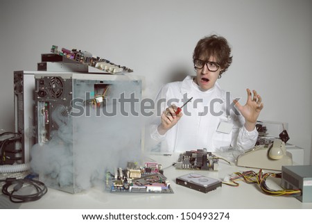 Computer technician is trying to repair a computer