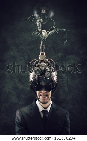 Cheerful businessman wearing a brain-control helmet