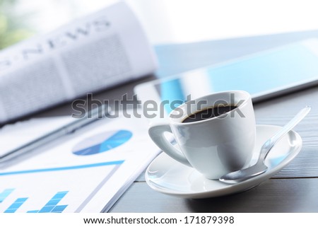 Business Office scene, coffee, documents and digital tablet on desk