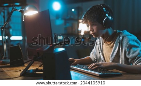 Similar – Image, Stock Photo Concentrated boy playing video game