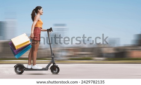 Similar – Image, Stock Photo Electric scooter with shopping bags and woman in background.