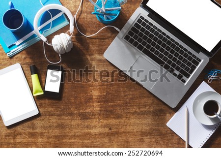 Desktop mock up with laptop, digital tablet, smartphone and stationery