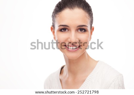 Smiling attractive woman with radiant fresh face skin posing on white background