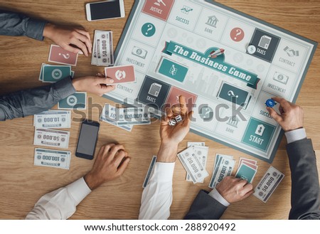 Business challenge board game and players at table rolling dices, hands close up, top view