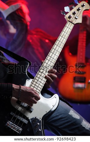 rock musicians playing at a live concert, similar photo on my portfolio