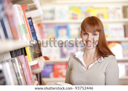portrait of a smiling young  student in a library