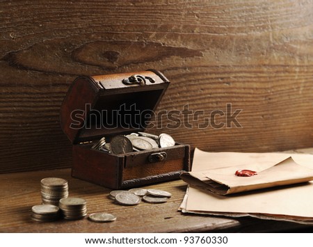 Treasure chest, old coins and mail paper