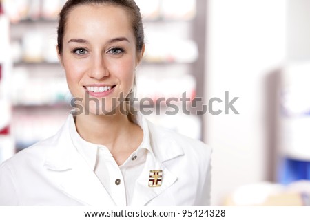 portrait of Young health care worker and background pharmacy.