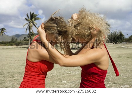 Two angry young women in quarrel.