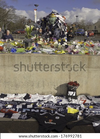 . Floral tributes left on the statue of Sir Tom Finney following his death at the age of 91 years of age on Friday 14th February 2014.  Preston, Lancashire, Uk. 16th February 2014