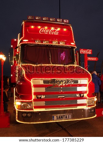 Blackpool, UK. 23rd November 2013. Illuminated fron view of the  Coca-Cola Christmas truck at Blackpool on its first leg of its month long tour around the uk.