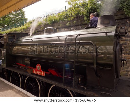 Bury, Lancashire, UK. 26th May 2014. Steam train taking on water at the station at the East Lancashire 40\'s weekend. Lancashire, UK