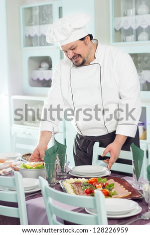 Chef decorating food in fine restaurant