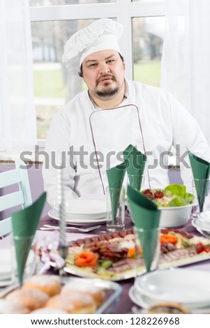 Chef decorating food in fine restaurant