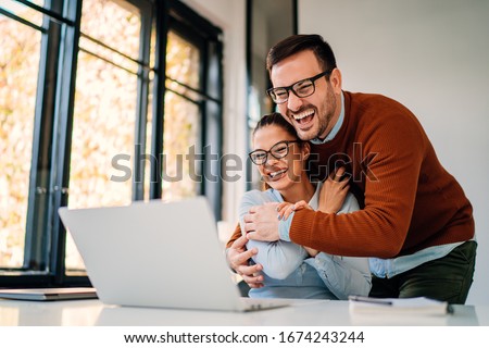 Similar – Image, Stock Photo Happy couple having video conversation on laptop at home