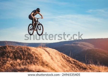 Similar – Image, Stock Photo Mountain biker in the Swiss Alps in autumn enjoying the special cloud panorama on the summit