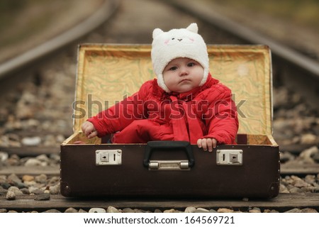 foundling, a small child in a suitcase