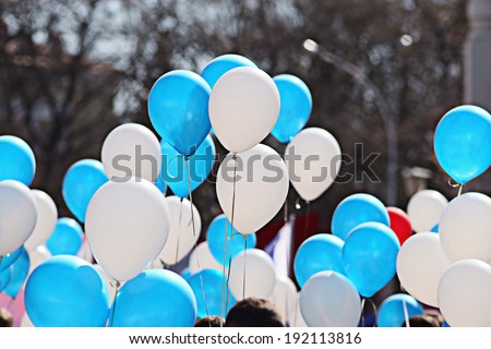 Blue and white balloons crowd