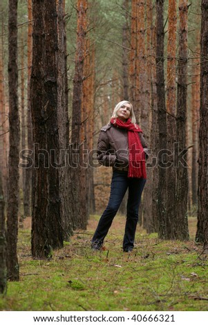 Young alone women in pine forest