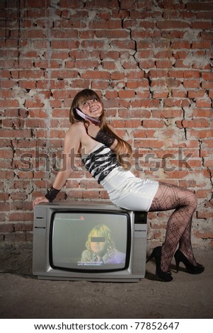 young girl on vintage TV receiver. expressed face