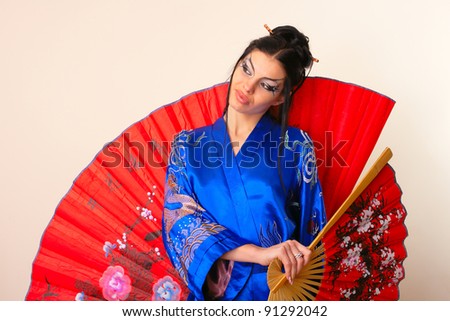 attractive girl with red asian fan