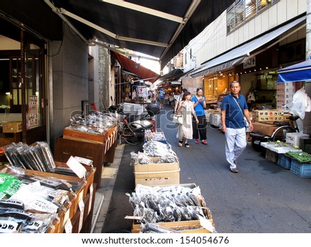 TOKYO, JAPAN- AUGUST 20, 2013: Tsukiji market is a large market for fish in central Tokyo. The market consists of small shops and restaurants crowded along narrow lanes. Tokyo, Japan. August 20 2013