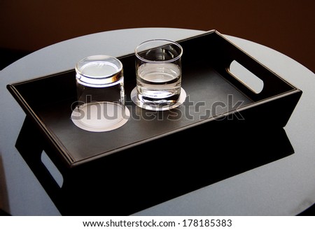 glasses in tray on table