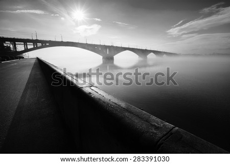 Krasnoyarsk, Russia - May 29, 2015: The embankment the bridge through the river Yenisei