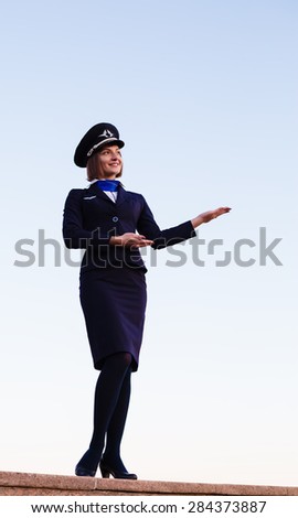 The young beautiful woman in the form of the stewardess