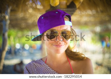 young pretty girl wearing sunglasses smiling