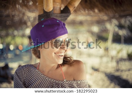 young pretty girl wearing sunglasses smiling