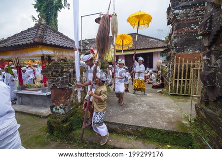 UBUD, BALI, INDONESIA - JUNE 25:  Unidentified local people wearing in traditional indonesian clothes take part in traditional Balinese  ceremony  on June 25, 2013 in Ubud, Indonesia