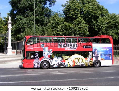 MADRID, SPAIN - JULY 2: Tourist bus in Madrid, Spain on July 2, 2012. Madrid City Tour is a new official touristic bus service that shows the city with an audio guide.