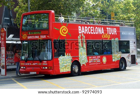 BARCELONA, SPAIN - SEPTEMBER 7: Tourist bus in Barcelona, Spain on September 7, 2011. Barcelona City Tour is a new official touristic bus service that shows the city with an audio guide.