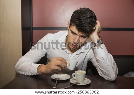 Close up Stressed Handsome Man Having a Cup of Coffee at the Cafe With Emtpy Stare