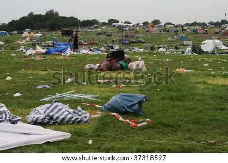 SCHLESWIG-HOLSTEIN, GERMANY - AUGUST 2: Camp site filled with litter after the Wacken Open Air, world\'s largest open air heavy metal music festival on August 2nd, 2009, in Schleswig-Holstein, Germany