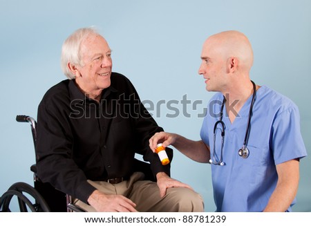Doctor talks about prescription with elderly patient.