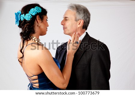 Cute mature couple, man and woman, in formal dress and a very romantic mood