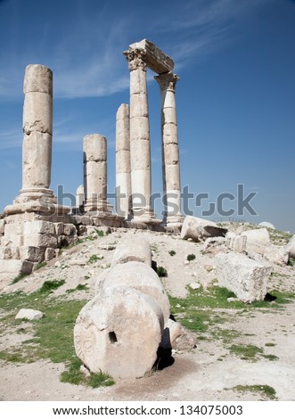 Ruins from the Middle East city of Amman, Jordan bronze age site called the Citadel, with the modern city in the background