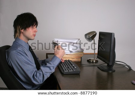 Businessman shaking fist at the computer